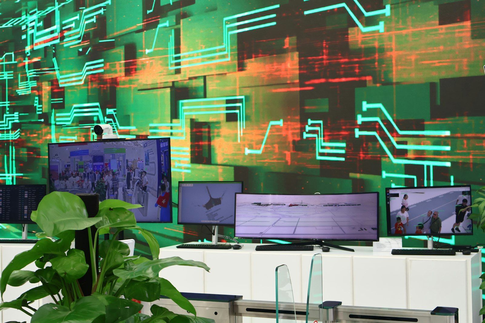 Glowing digital screens displaying data streams against a circuit board background